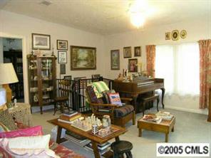 7923 Walkup Road Waxhaw, NC 28173 - Photo 3 of 8 a living room with furniture and wooden floor