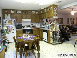 7923 Walkup Road Waxhaw, NC 28173 - Photo 6 of 8 a kitchen with a table and chairs in it
