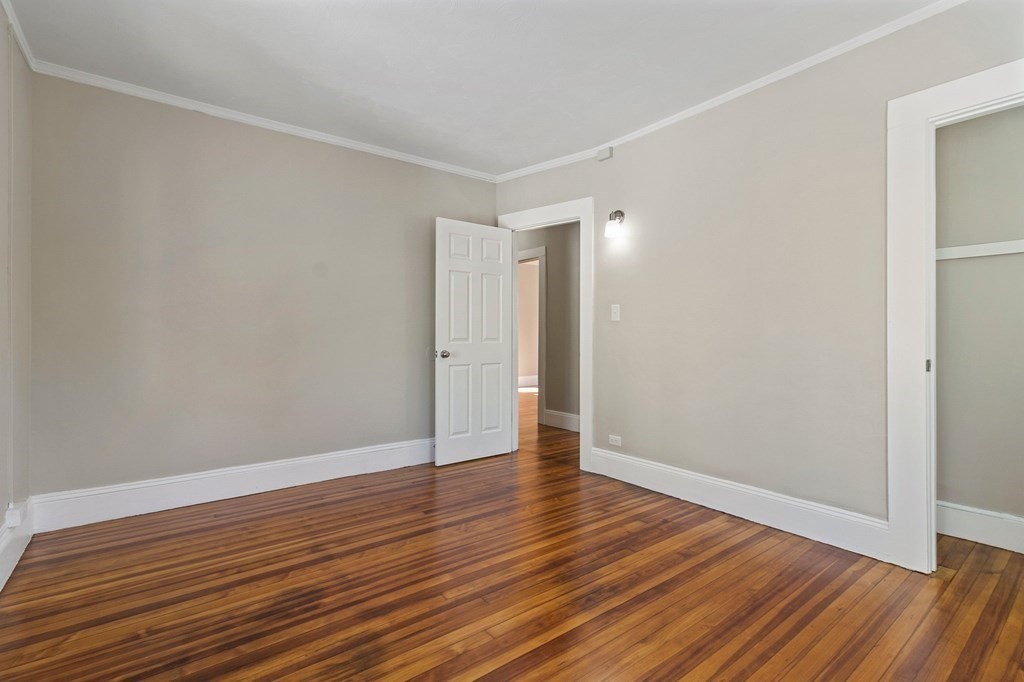 383 White Street Springfield, MA 01108 - Photo 11 of 39 a view of an empty room with wooden floor