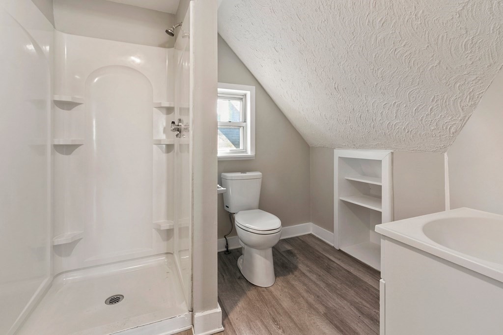 383 White Street Springfield, MA 01108 - Photo 13 of 39 a bathroom with a toilet and a shower