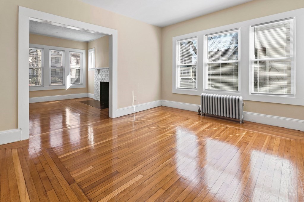 383 White Street Springfield, MA 01108 - Photo 21 of 39 a view of empty room with wooden floor and fan