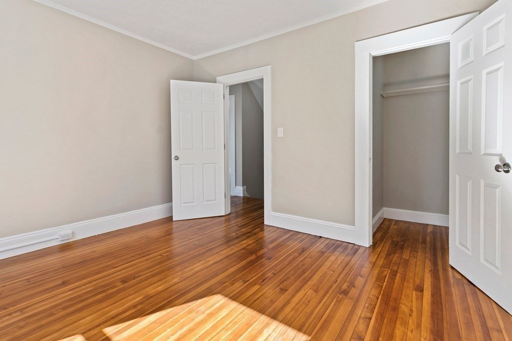 383 White Street Springfield, MA 01108 - Photo 24 of 39 a view of an empty room with wooden floor and a window