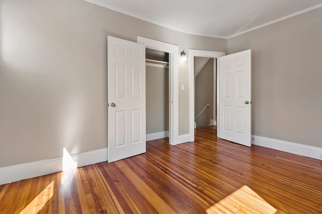 383 White Street Springfield, MA 01108 - Photo 27 of 39 an empty room with wooden floor and closet