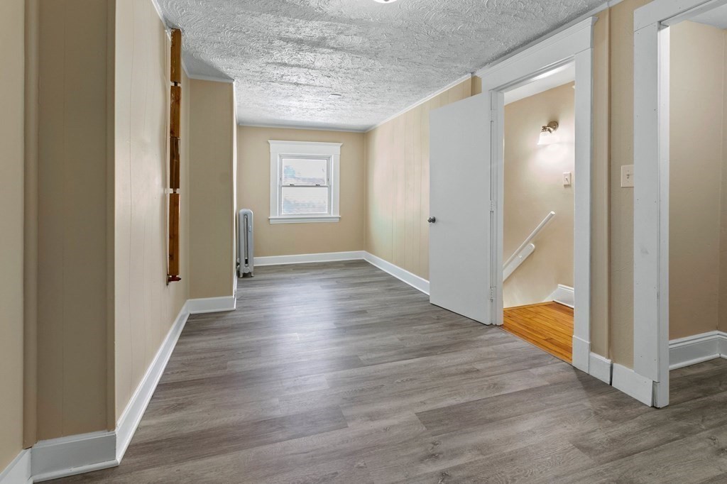 383 White Street Springfield, MA 01108 - Photo 31 of 39 a view of a hallway with wooden floor and entryway