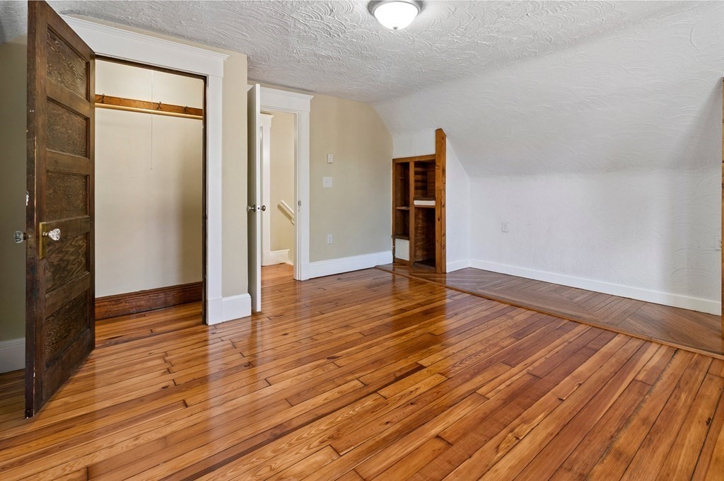 383 White Street Springfield, MA 01108 - Photo 33 of 39 an empty room with wooden floor and windows
