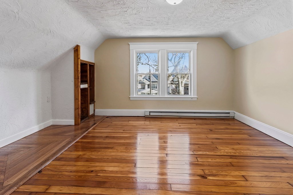 383 White Street Springfield, MA 01108 - Photo 34 of 39 a view of an empty room with wooden floor and a window