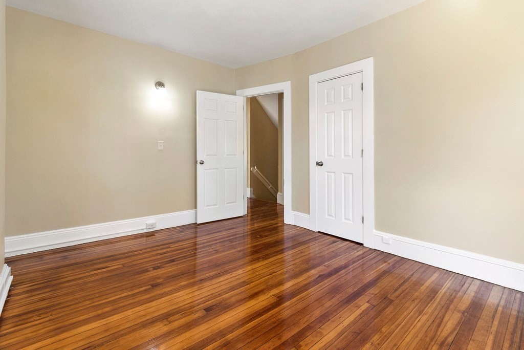 383 White Street Springfield, MA 01108 - Photo 36 of 39 a view of an empty room with wooden floor