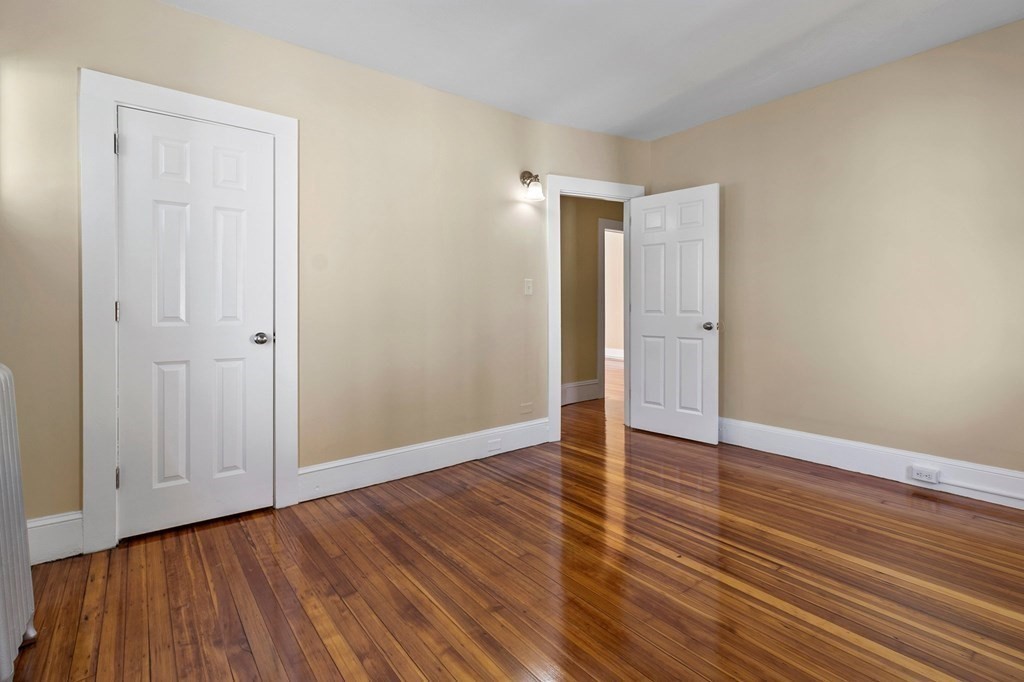 383 White Street Springfield, MA 01108 - Photo 38 of 39 a view of an empty room with wooden floor