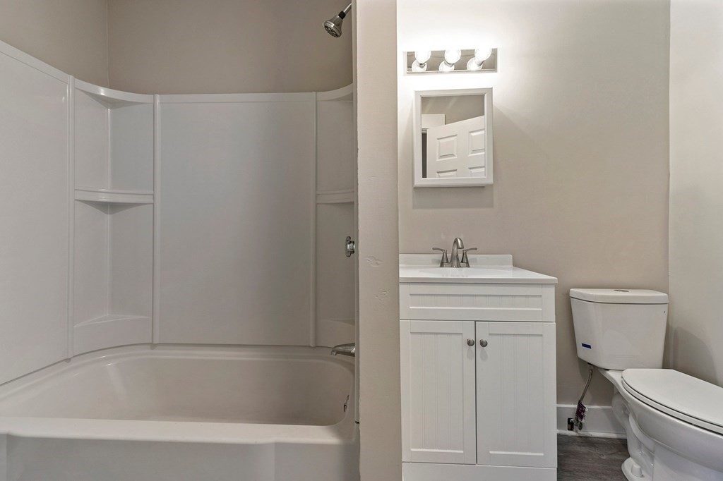 383 White Street Springfield, MA 01108 - Photo 8 of 39 a bathroom with a sink a toilet and shower
