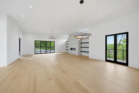 a kitchen with granite countertop a stove and a sink