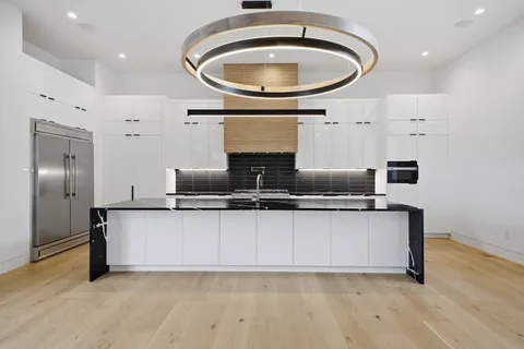 a view of a kitchen with a sink and a window