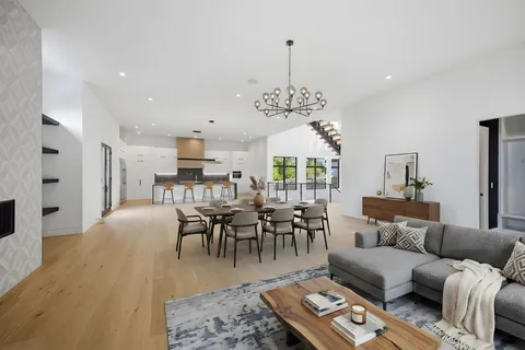 a view of a livingroom with furniture and chandelier