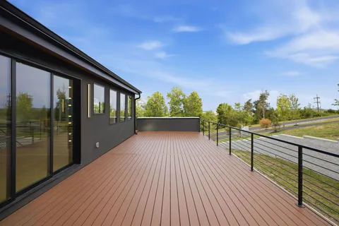 a view of a patio with a table and chairs