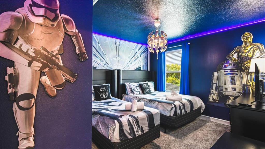 2916 Simile Street Kissimmee, FL 34746 - Photo 12 of 55 a bedroom with bed and a chandelier