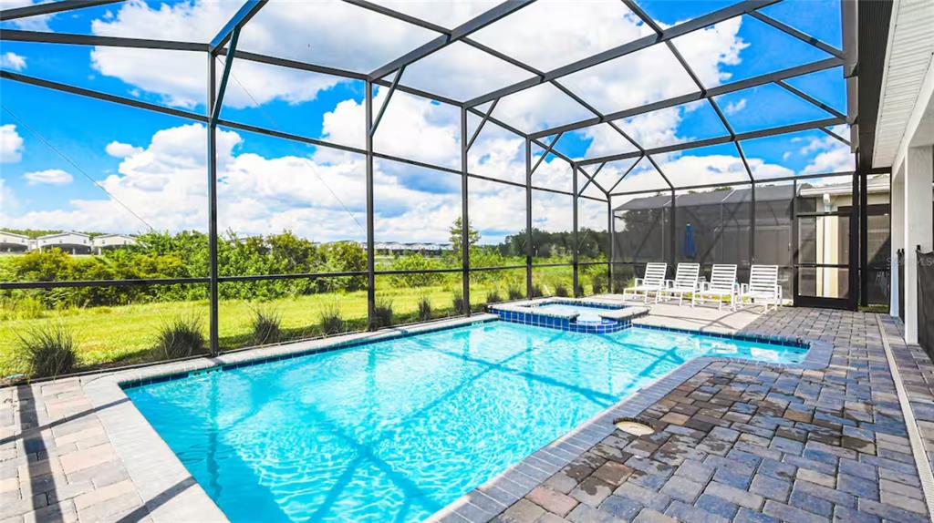 2916 Simile Street Kissimmee, FL 34746 - Photo 34 of 55 a view of swimming pool with a patio
