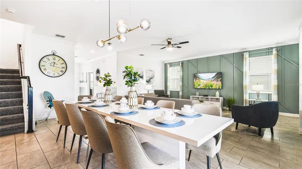2916 Simile Street Kissimmee, FL 34746 - Photo 7 of 55 a view of a dining room with furniture window and wooden floor