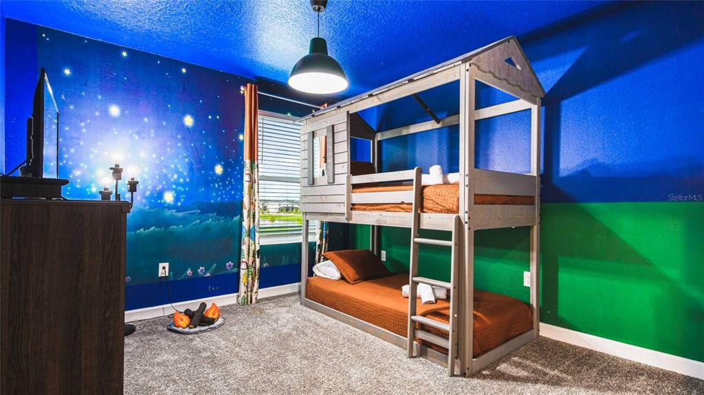 2916 Simile Street Kissimmee, FL 34746 - Photo 10 of 55 a bedroom with a bed and a balcony