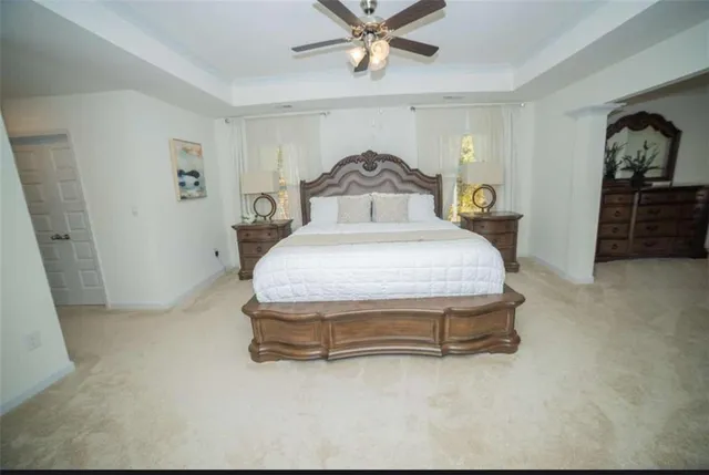 a bedroom with a bed and window