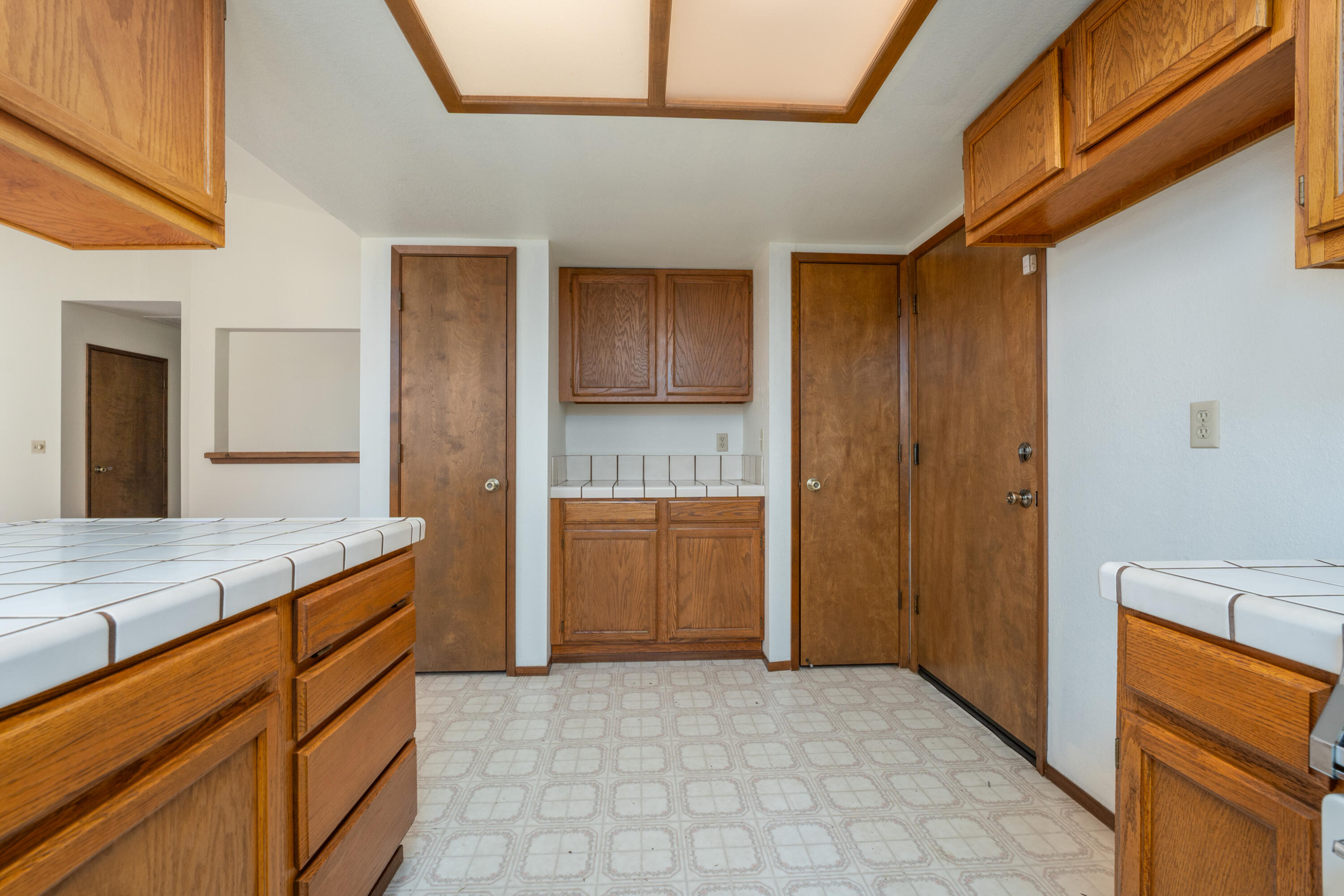 853 Oakmont Drive Redding, CA 96003 - Photo 11 of 37 a kitchen with cabinets and wooden floor