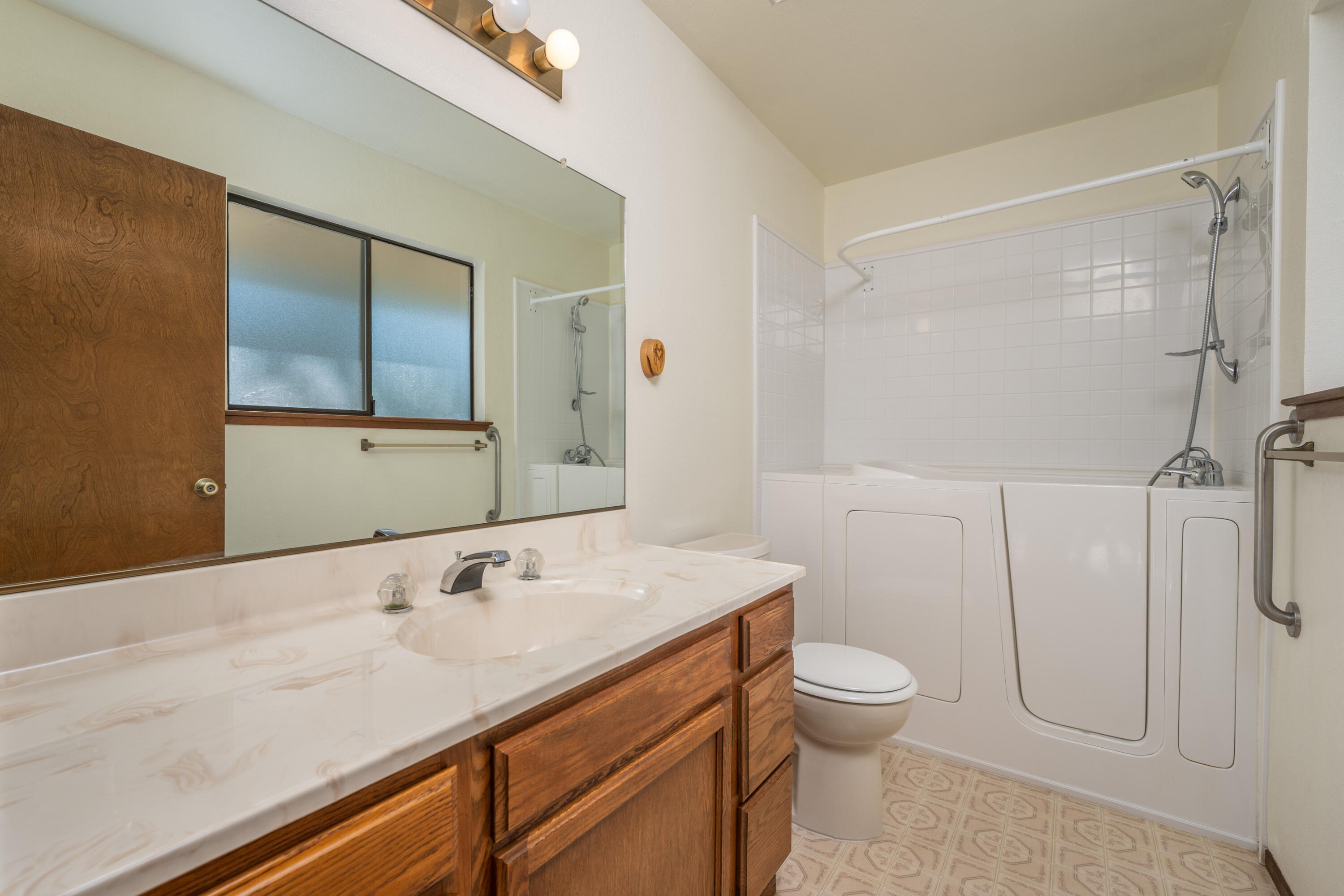 853 Oakmont Drive Redding, CA 96003 - Photo 23 of 37 a bathroom with a sink a toilet and shower