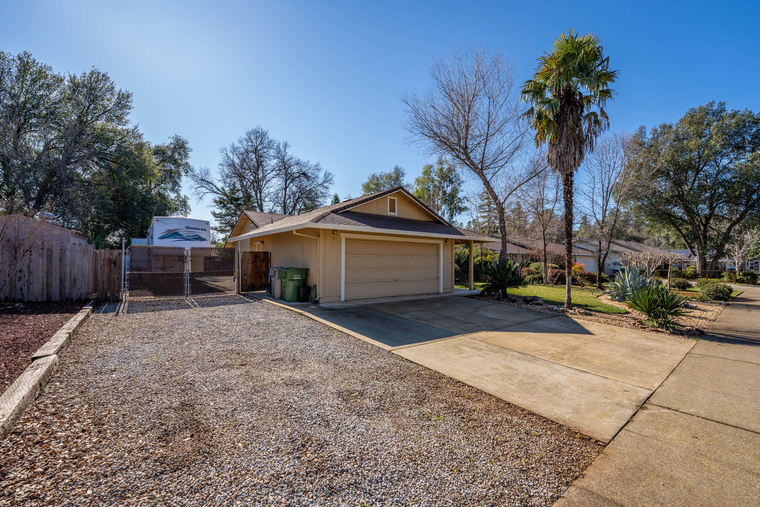 853 Oakmont Drive Redding, CA 96003 - Photo 28 of 37 a front view of a house with a yard and garage