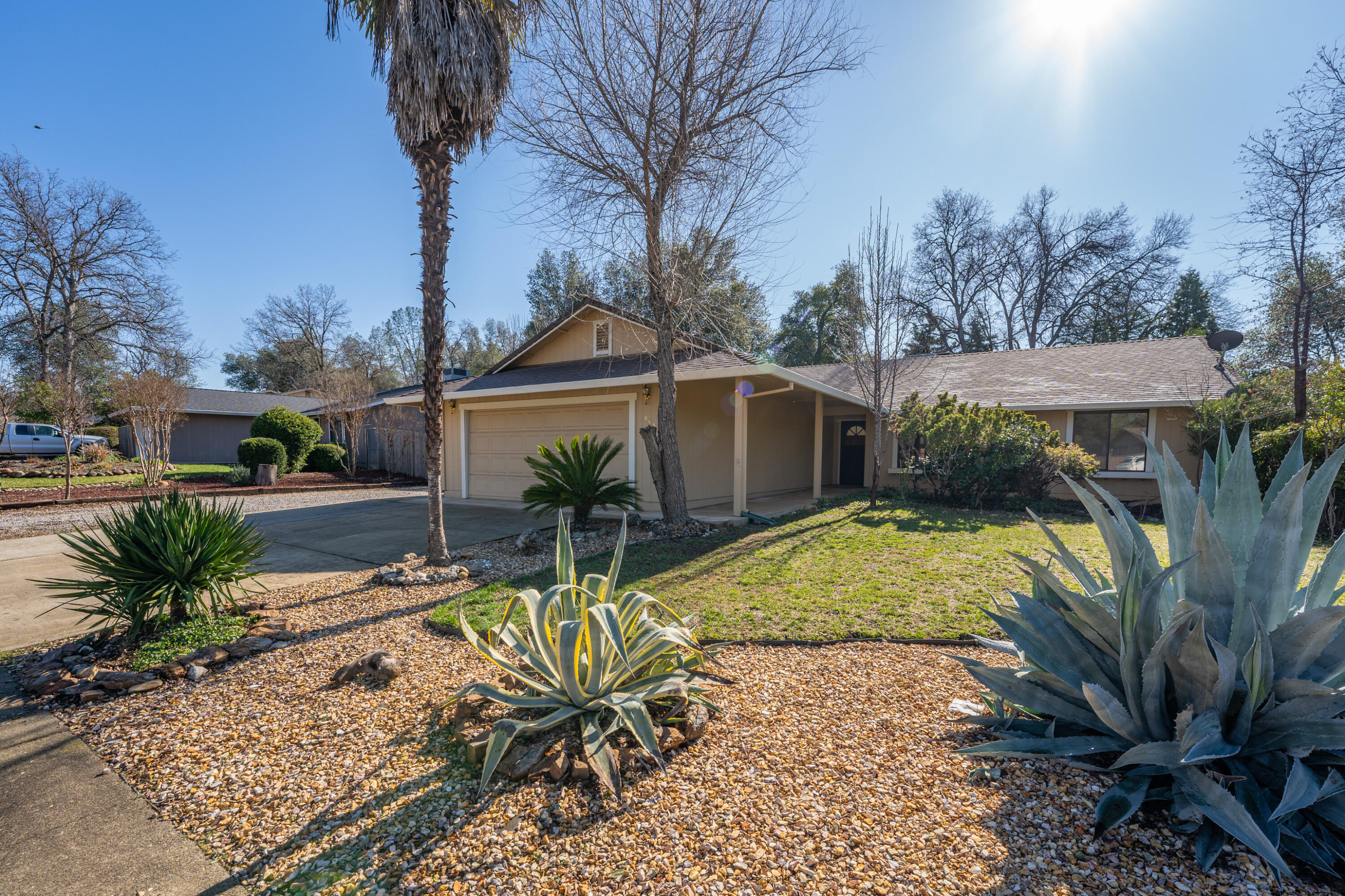 853 Oakmont Drive Redding, CA 96003 - Photo 29 of 37 a view of a backyard with plants and swimming pool