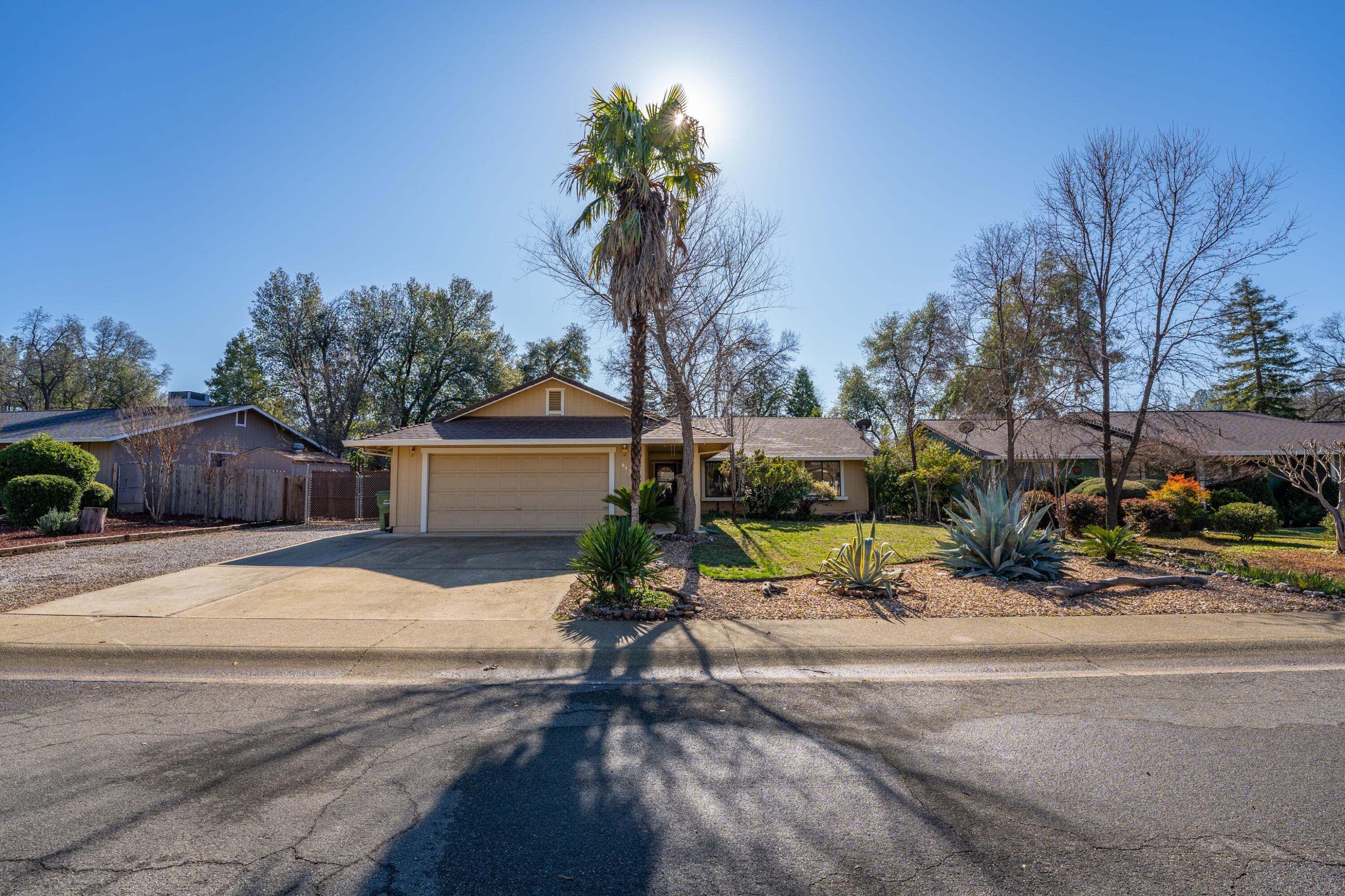 853 Oakmont Drive Redding, CA 96003 - Photo 30 of 37 a street sign on a sidewalk next to a road