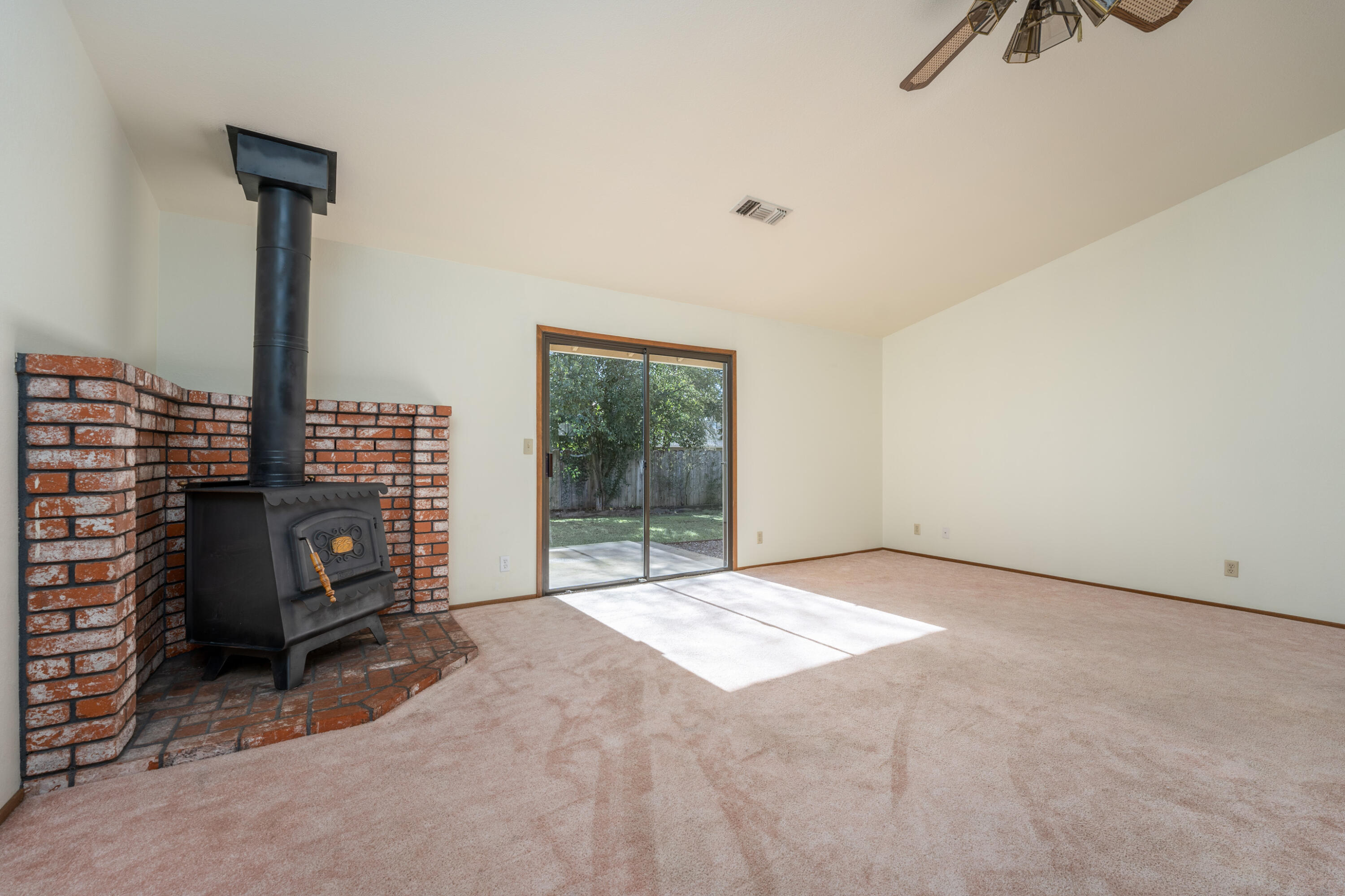 853 Oakmont Drive Redding, CA 96003 - Photo 6 of 37 a view of an empty room with furniture and a window