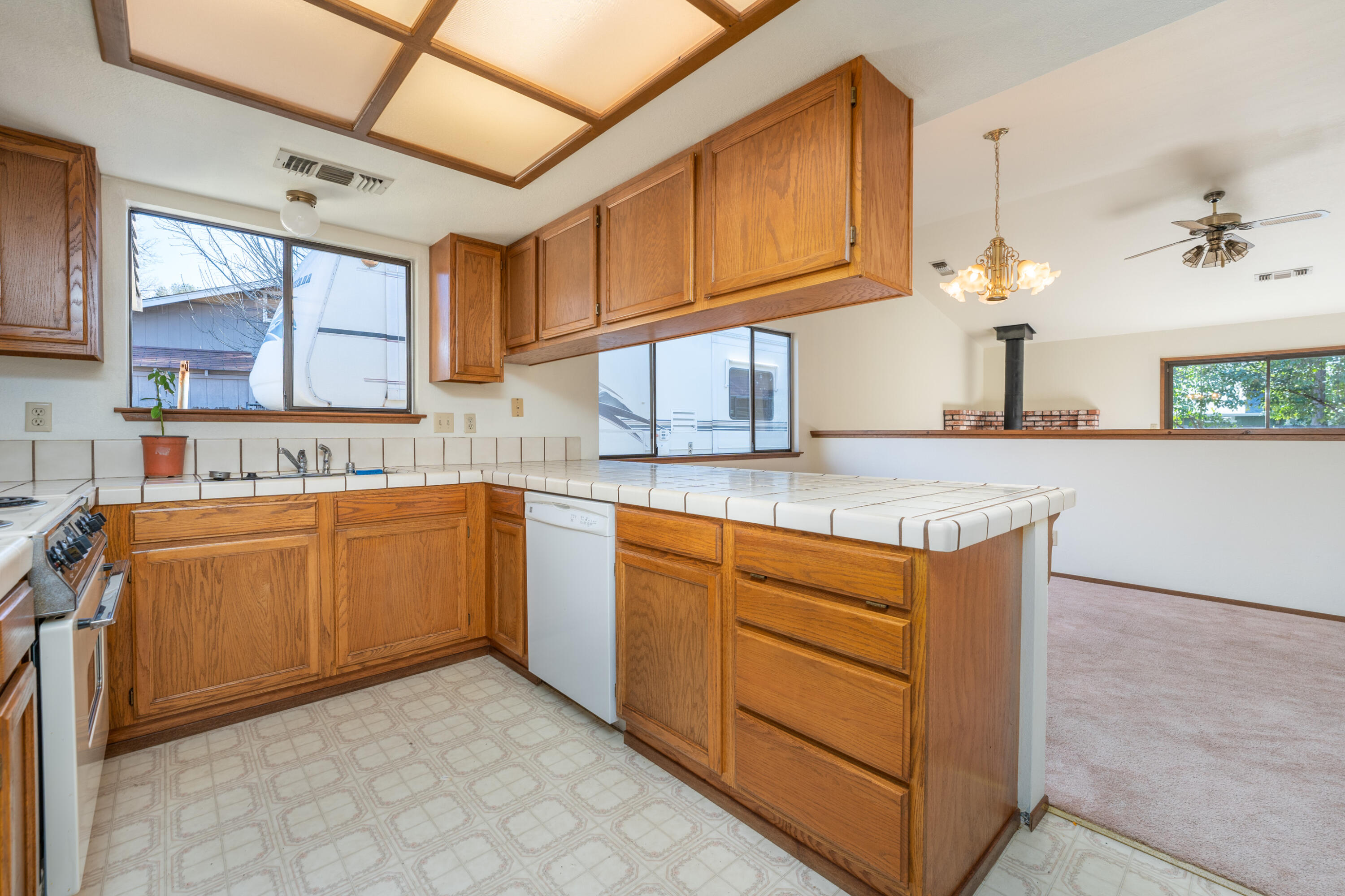 853 Oakmont Drive Redding, CA 96003 - Photo 9 of 37 a kitchen with cabinets a sink and appliances