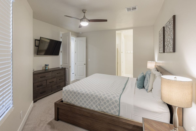 4845 Fishers Is Way St. George, UT 84770 - Photo 6 of 41 Bedroom featuring light carpet and ceiling fan