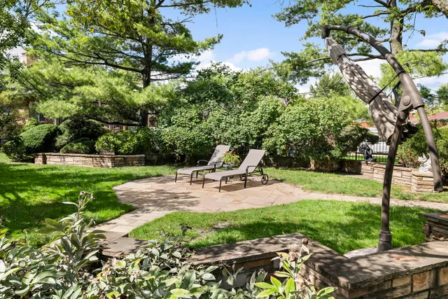 a view of a backyard with sitting area