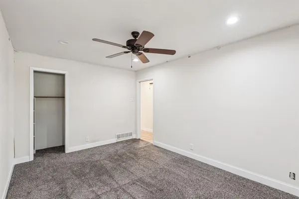 a view of a big room with carpet
