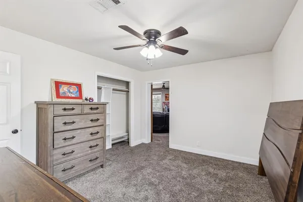 a view of a livingroom with a ceiling fan