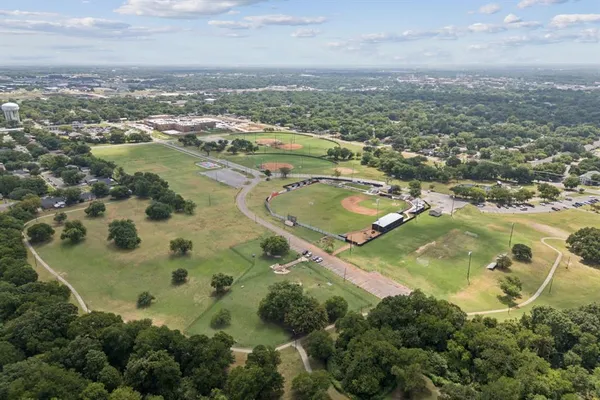 an aerial view of residential houses with outdoor space