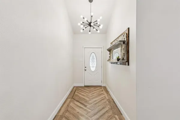 a view of bedroom with wooden floor