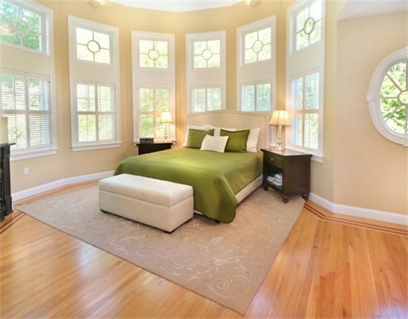 75 Page Road Lincoln, MA 01773 - Photo 12 of 25 a spacious bedroom with a bed and a large window
