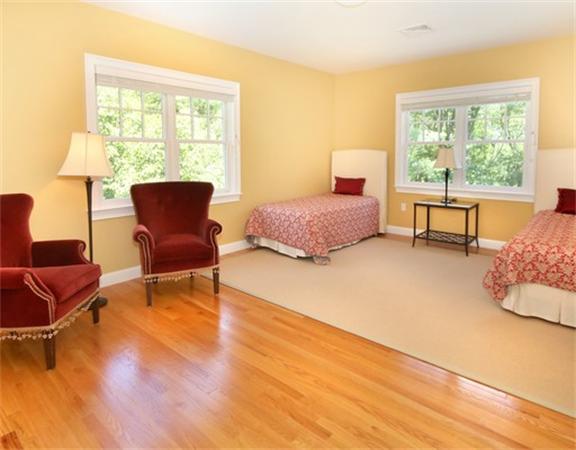 75 Page Road Lincoln, MA 01773 - Photo 18 of 25 a bedroom with a bed chair and a window