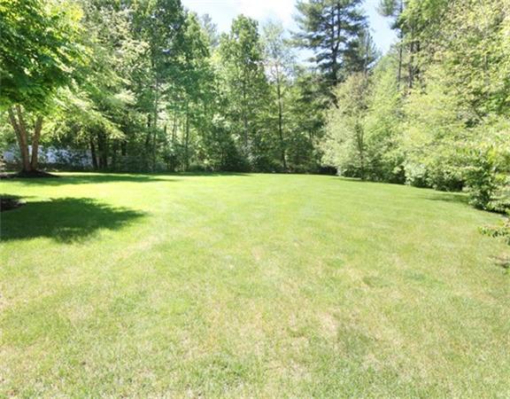 75 Page Road Lincoln, MA 01773 - Photo 23 of 25 a view of a yard with a trees