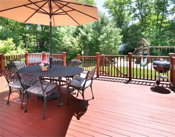75 Page Road Lincoln, MA 01773 - Photo 24 of 25 a view of a roof deck with table and chairs a barbeque with wooden floor and fence