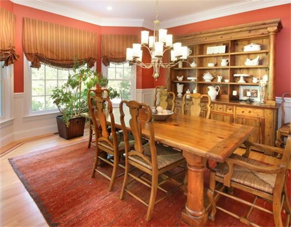 75 Page Road Lincoln, MA 01773 - Photo 4 of 25 a dining room with furniture a chandelier and wooden floor