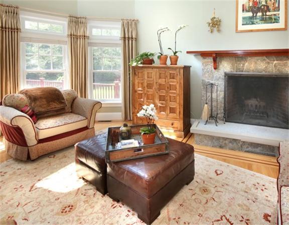 75 Page Road Lincoln, MA 01773 - Photo 6 of 25 a living room with furniture and a fireplace