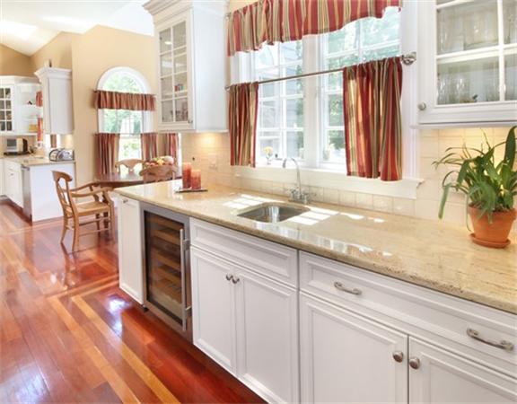 75 Page Road Lincoln, MA 01773 - Photo 9 of 25 a kitchen with stainless steel appliances granite countertop a sink a stove and a wooden floors