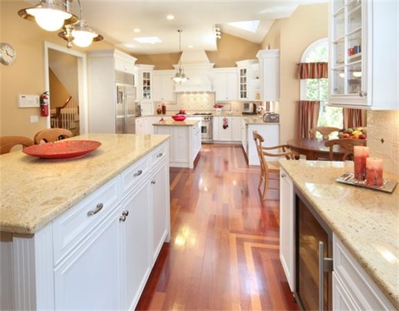 75 Page Road Lincoln, MA 01773 - Photo 10 of 25 a kitchen with stainless steel appliances kitchen island granite countertop a lot of counter space and wooden floors