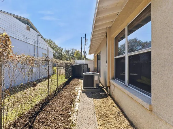 a view of a balcony with a potted plant