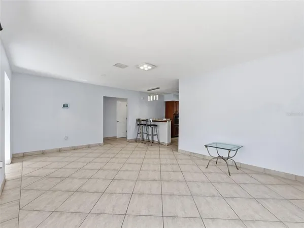 a view of a livingroom with furniture and a window