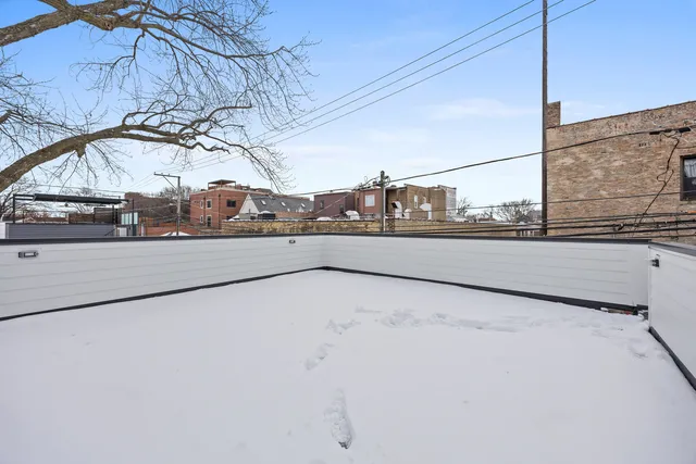 a front view of house along with deck