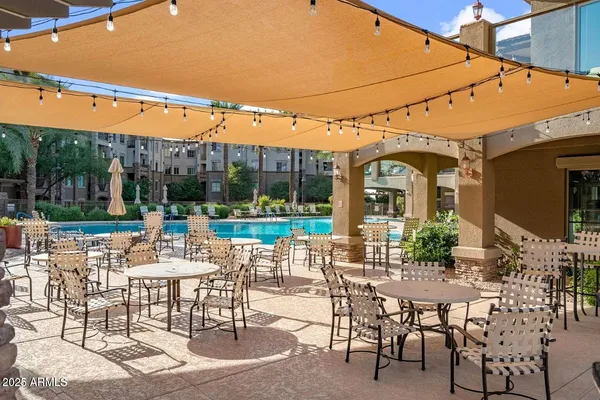 a view of a patio with a table chairs and a table