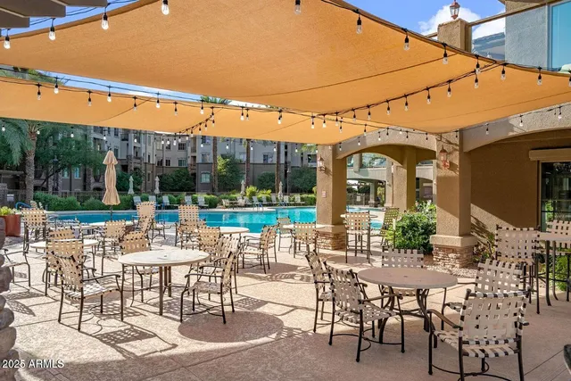 a view of a patio with a table chairs and a table