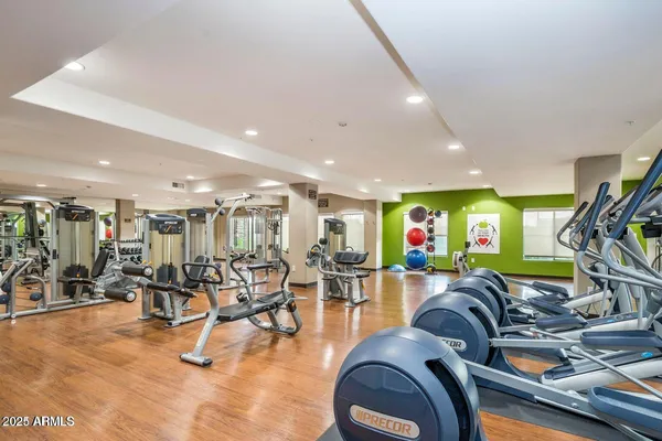 a gym room with lots of gym equipment