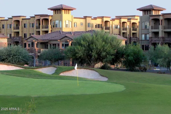a front view of a building with garden